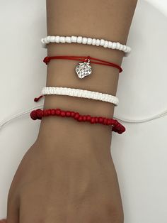 Strawberry Strawberries Charm Friendship Bracelet. Pura Vida style string, braided, woven, beaded, adjustable bracelet.  Fits most wrists and are stackable.  Perfect for everyday casual wear, activities, and special events. Can be worn individually or as a set. SIZING: White Braided Bracelet:  6 - 11 inches Beaded Red/White Bracelet:  2.36 inches CARE: Bracelets are durable, but excess pulling or yanking may cause them to break. SPECIAL NOTES: Your new bracelet may be slightly sticky/tacky for a few days.  This will not last, but may make adjusting slightly difficult for a bit. White Braided Beaded Bracelets As Gift, White Braided Casual Jewelry, Casual White Braided Jewelry, White Braided Bracelet With Adjustable Cord, White Braided Adjustable Beaded Bracelets, Casual Braided Beaded Bracelets As Gift, Casual Braided Beaded Bracelets For Gift, Casual Heart Beads Friendship Bracelets For Beach, Casual Beaded Bracelet With Macrame And Round Beads