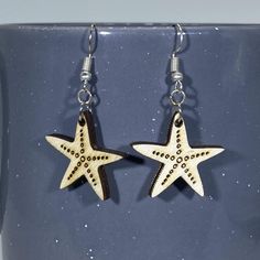 Description Starfish Wooden Dangle Earrings that are loved in Florida. This cute animal jewelry is light, hypoallergenic, nickel-free, and great for the beach. Extremely lightweight - all earrings are less than .1 ounces. Hypoallergenic, nickel-free All earrings are made from surgical steel Carefully cut from Birch for both beauty and strength Hand-painted Lifetime replacement for the cost of shipping Custom designs available, our motto is “if you dream it, we will make it an earring.” Size Leng Light Earrings, Dream It, You Dream, Animal Jewelry, Jewelry Ideas, Starfish