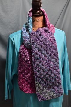 "Add a pretty accent to your winter wardrobe with this beautiful hand-crocheted scarf in tweedy shades of turquoise and purple. Crocheted of soft acrylic yarn in a pretty diagonal stripe pattern, this scarf will keep you toasty warm this winter. Colors vary slightly from photographs. Machine wash cool and tumble dry low.  62\"L x 7 \"W Also makes a wonderful gift!" Violet Crochet, Diagonal Stripes Pattern, Crocheted Scarf, Hand Knit Scarf, Turquoise And Purple, Shades Of Turquoise, Diagonal Stripes, Teal And Pink, Crochet Scarves