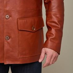 This rugged Safari Leather jacket is a vintage look that is sure to keep you warm while you brave the cold. Adorned with two upper pockets and two lower pockets, this piece enables you to pack as heavy or light in the cold as you like. Layer this Safari Jacket with a lightweight sweater or simple button down to achieve a dynamic look of western sophistication. Model is 6'1 and wearing size M. Rugged Leather Jacket With Pockets For Winter, Winter Brown Leather Jacket With Pockets, Brown Leather Jacket With Pockets For Winter, Classic Leather Jacket With Pockets For Cold Weather, Fitted Classic Brown Utility Jacket, Classic Fitted Brown Utility Jacket, Brown Winter Outerwear With Flap Pockets, Classic Leather Outerwear With Patch Pockets, Rugged Outerwear With Double-needle Stitching