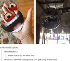 a person holding up a cell phone in front of a ceiling fan with eyes and mouth painted on it