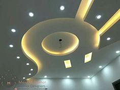 the ceiling in this room is decorated with white lights and recessed lighting that are suspended from the ceiling