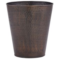 a large metal cup sitting on top of a table