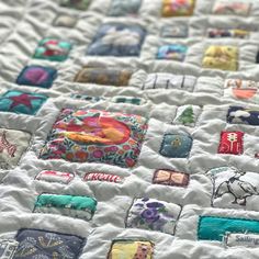 a close up of a quilt on a bed