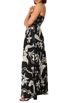 Swing into summery style wearing this strapless maxi patterned in sketched flowers and shaped by allover pleats and smocking across the back. Hidden back-zip closure Strapless Smocked back Partially lined 100% polyester Hand wash, dry flat Imported Black Maxi Dress With Pleated Waist, Summer Bandeau Pleated Dress, Chic Bandeau Floral Maxi Dress, Chic Bandeau Maxi Dress With Floral Print, Summer Strapless Maxi Dress With Pleated Bodice, Black Maxi Dress With Pleated Bodice For Spring, Sketched Flowers, Strapless Maxi, Pleated Maxi Dress