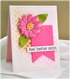 a close up of a card with a pink flower on it and the words feel better soon