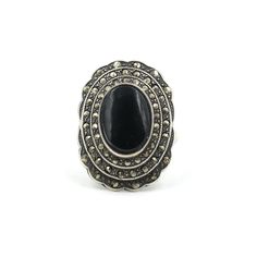 "Vintage onyx and marcasite tiered ring sterling silver ring. Classic elegant statement. Marked \"Sterling\". In good vintage condition. All marcasites are in tact. Piece has been left with its vintage patina but a polishing cloth is included if you prefer something brighter. Size: 7.5 Measures: 1\" Tall  Weighs: 6.98 grams More marcasite in the shop: Onyx & sterling statement earrings - https://etsy.me/34BT9YW Abalone and marcasite band - https://etsy.me/36bhUeX *Free Domestic Shipping on Order Vintage Marcasite Oval Rings, Elegant Silver Marcasite Rings, Vintage Onyx Ring, Vintage Onyx Ring 1stdibs, Vintage Marcasite Silver Jewelry, Vintage Marcasite Jewelry Gift, Brass Cuff, Antique Watches, Brass Bracelet