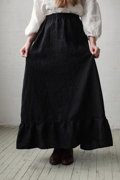 Victorian style inspired long skirt is made from 100% soft and washed linen. Wear it with belt or without. Match it with our tunics! Details: - Composition: 100% Oeko-Tex certified linen - Colour: black - Ruffled skirt - Comes with the belt - Pockets - Elastic waist - Medium weight linen - Linen care: machine wash gentle; tumble dry low, ironing optional - The price is for one skirt, other pictured items are not included Linen Tiered Skirt, Peasant Style Relaxed Fit Lined Skirt, Cotton Skirt With Unfinished Hem, Bohemian Linen Bottoms With Relaxed Skirt, Ruffled Tiered Linen Skirt, Bohemian Linen Bottoms With Relaxed Skirt Fit, Linen Tiered Skirt With Ruffles, Fitted Linen Bottoms With Ruffles, Peasant Style Relaxed Lined Skirt