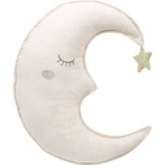 a white pillow with a sleeping moon on it