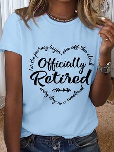 a woman wearing a light blue t - shirt with the words officially retired printed on it