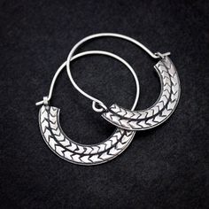 The handmade Sterling Silver Geometric Hoop Dangle earrings are quick to become your go to pair. The details: Total length of hoops is 1.5" long and approximately 1.5mm wide. Tension closure Hoop earrings Made of 100% recycled Argentium Sterling Silver Tarnish Resistant and Nickel Free, these earrings are easy to wear and require little upkeep. Hand carved Chevron Texture with oxidized depth so that the chevron pattern stands out, even from afar. Looking for a highly polished version of these? I Small Hoop Earrings With Oxidized Finish, Adjustable Oxidized Hoop Earrings, Adjustable Oxidized Finish Hoop Earrings, Adjustable Small Hoop Earrings With Oxidized Finish, Small Hoop Sterling Silver Earrings For Festival, Hoop Dangle Earrings, Polish Silver, Chevron Pattern, Silver Hoops