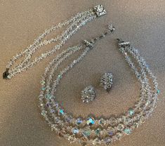 Beautiful Vintage Clear Crystal Necklace, Bracelet and Clip Earrings Set Unsigned with no makers markings  Stunning Eye Catcher!! Perfect condition with no damage or missing stones Great piece to add to any collection.  I ship on Tuesdays and Thursdays Thank you for looking! Sparkling Crystal Costume Jewelry, Vintage Crystal Jewelry With Matching Earrings, Vintage Sparkling Round Jewelry, Pearl Rope, Juliana Jewelry, Clear Crystal Necklace, Vintage Jewelry Ideas, Vintage Jewelry Antique, Antique Costume Jewelry