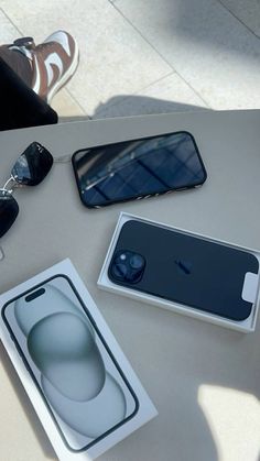 an iphone is sitting on a table next to some sunglasses and eyeglasses,