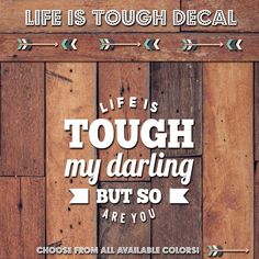 the words life is tough, my daring but so are you on wooden planks