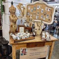 a table with jewelry on display in a store