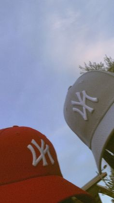 a baseball cap with the new york yankees logo on it and trees in the background