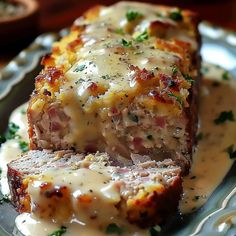 meatloaf covered in gravy on a plate