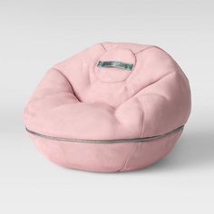 a pink bean bag chair sitting on top of a white floor