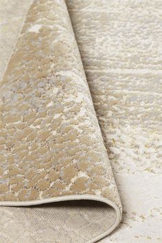 an area rug with white and beige colors