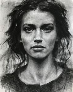 a black and white drawing of a woman's face with hair blowing in the wind