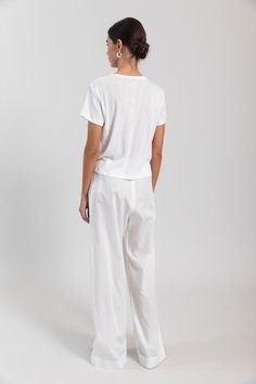 Please note this item is available for pre-order only at this time. Estimated shipping: Late May. Breeze into summer. Our bestselling Yoko Pocket Pant returns: Cut in 100%, crisp cotton lawn, this wear-anywhere pant features a comfortable elasticized waistband, side seam pockets, the perfect relaxed fit. White Relaxed Bottoms With Side Pockets, White Relaxed Fit Pants With Side Pockets, White Cotton Parachute Pants With Side Pockets, White Relaxed Fit Cotton Cargo Pants, White Wide-leg Cotton Cargo Pants, Keep Cool, Pocket Pants, White Undershirt, Elastic