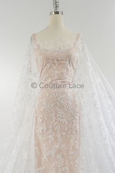 Are you searching for exquisite floral bridal lace, floral French lace, or off-white flower lace for your dream wedding gown? Look no further! Our collection features a stunning array of couture lace options that will elevate your wedding attire to new heights. Whether you desire a delicate floral pattern or a timeless design, our floral wedding lace is meticulously crafted to make your gown truly unforgettable. Explore our exclusive range of couture lace today and let your bridal vision come to Delicate White Lace Wedding Dress, Delicate Lace Tulle Fabric For Wedding, Fitted Delicate Lace Tulle Fabric For Wedding, Delicate Lace With Patchwork For Wedding, White Lace Wedding Dress With Lace Back, Cream Lace Dress For Wedding With Delicate Details, White Lace Back Dress For Wedding, Fitted Tulle Fabric With Delicate Lace For Wedding, Cream Crochet Lace Dress For Wedding