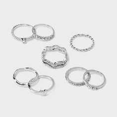 Eight-piece ring set from Wild Fable™ with silver tones and varying designs. Includes heart signet rings, crystal rings, band rings and more. Great for pairing with your favorite necklaces and earrings. If you’re not satisfied with any Target Owned Brand item, return it within one year with a receipt for an exchange or a refund. Wild Fable™: A look for every story. Pretty Rings Silver Set, Dainty Silver Rings Set, Rings Silver Sets, Fake Silver Ring, 6 Pack Rings, Cute Cheap Silver Jewelry, Saniro Ring, Coqquete Rings, Simple Silver Rings