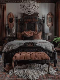 a bedroom with an ornate bed, chandelier and rugs on the floor