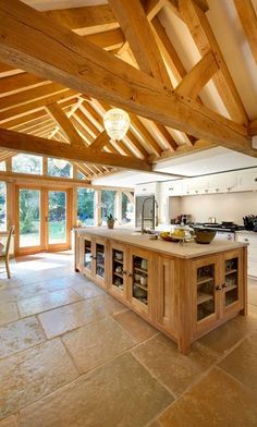 a large kitchen with an island in the middle