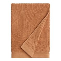 a tan towel with an intricate design on the front and back, folded in two rows