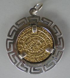 Phaistos Disk Handmade silver pendant. The Original Phaistos Disc is a disk of fired clay founded in the Minoan palace of Phaistos on the Greek island of Crete possibly dating to the middle or late Minoan Bronze Age. The pendant is crafted with extra care in 925 Sterling Silver(Gold Plated on the inside). A perfect anniversary gift idea for your beloved one. It was made in Greece, diameter size is 26mm and weighs approximately 8.5 g. All our prices are final including packaging, insurance and 's Ancient Silver Collectible Jewelry, Ancient Style Round Silver Necklace, Ancient Style Collectible Silver Jewelry, Ancient Style Silver Round Necklaces, Unique Silver Coin-shaped Jewelry, Unique Silver Coin Jewelry, Ancient Style Silver Jewelry Gift, Silver Ancient Style Jewelry For Gift, Minoan Palace