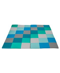 a blue and grey rug with squares on the floor in front of a white background