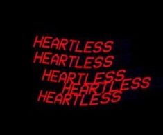 the words heartless, heartless, and fearless are lit up in red on a black background