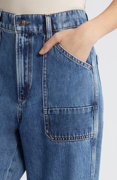 Slanted pockets and a cargo patch pocket lend a utilitarian-inspired style to these wide leg jeans fashioned from nonstretch denim. 28 1/2" inseam, 21" leg opening; 12 1/2" front rise; 16" back rise (size 29) Zip fly with button closure Front slant pockets; cargo patch pocket; back patch pockets 100% cotton Hand wash, dry flat Imported Modern Straight Leg Denim Cargo Jeans, Modern Wide Leg Denim Cargo Jeans, Casual Workwear Cropped Jeans With Patch Pockets, Casual Cropped Jeans With Patch Pockets For Work, High Rise Utility Jeans With Welt Pockets, Modern Flare Jeans With Pockets In Rigid Denim, Dark Wash Cargo Jeans With Patch Pockets, Utility Jeans With Patch Pockets In Rigid Denim, Utility Cropped Leg Jeans With Hip Pockets