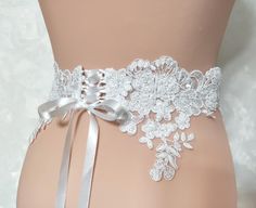 Color: white Lace size: width 6-10cm. You can choose the type of belt tie: 1. Handmade buttons. 2. Handmade buttonholes and corset cord, tape 2m. 3. Tulle belt. The width of the belt 50cm, the length of the belt 3m. 4. Organza belt. Belt width 8cm, belt length 3m. White Corset Belt, Handmade Buttonholes, Lace Sash, Girls Belts, Handmade Buttons, Wedding Sash Belt, Belt Tie, White Corset, Wedding Sash