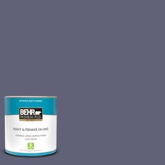 a can of behr paint and primer in one on a dark blue background