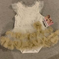 Any Baby Girl Would Be So Cute In This Cream/Ivory Ruffle Onesie. Nwt Fitted Cream Bubble Romper With Ruffles, Cream Fitted Bubble Romper With Ruffles, Cream Bubble Romper With Ruffles For Baptism, Cream Ruffled Bubble Romper For Baptism, Cute Cream Bubble Romper With Ruffles, Cute Beige Bubble Romper With Ruffles, Cute Beige Ruffled Bubble Romper, Cream Ruffle Dress For First Birthday, Ruffle Onesie