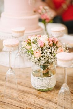 the bride's bouquet and champagne glasses are ready to be served at her wedding