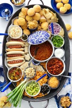 a platter filled with lots of different foods and condiments on top of it