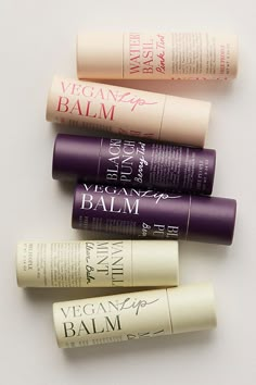 Formulated with a blend of natural butters and oils, this daily, plant-based lip balm nourishes and protects the lips in three juicy flavors. Grapeseed oil and sunflower seed oil nourish and soften; shea butter and cocoa butter condition and protect; and candelilla wax provides a moisturizing, breathable barrier. Packaged in a 100% recyclable FSC paper tube. * 0.35 oz. * Vegan & Cruelty-free * Free of parabens, petroleum and artificial colorants * Made in the USA **Sweet Vanilla Mint Flavor:** C Lip Balm Paper Tube, Lip Balm Packaging Ideas, Lip Balm Photography, Lip Balm Tube Packaging, Lip Balm Design, Small Business Ideas Products, Balm Packaging, Packaging Design Beauty, Natural Cosmetics Brands