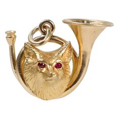 A very fine signed Edwardian fox hunt charm. In 14 karat yellow gold. By Whiteside & Blank. Comprised of a fox head mounted on gold trumpet that is with flush-set tiny round ruby eyes. With an attached bale to easily add chain or attach to a charm bracelet. Simply a wonderful Edwardian fox hunt pendant! Date: Early 20th Century Overall Condition: It is in overall good, as-pictured, used estate condition with some fine & light surface scratches and other signs of expected light wear consistent wi Gold Fox, Fox Jewelry, Fox Head, Fox Hunting, Best Wear, Fox, Jewelry Necklace Pendant, Bracelet, Charm Bracelet