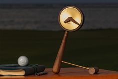 an illuminated golf ball and tee on a table