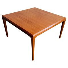 a wooden table with two legs and a square shape on the top, against a white background