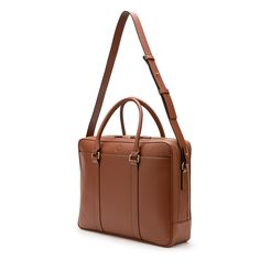 Leather briefcase designed to carry work documents or as a weekend travel bag.  Made of natural vegetable tanned leather, it can carry A4 documents, a 15" computer or clothes. Includes 5 internal compartments and an external pocket with magnetic closure. It can be carried in the hand or on the shoulder thanks to its removable shoulder strap and has a back strap to attach it to a suitcase. The leather is dyed with natural tannins and treated with olive oil, which gives it a unique patina over tim Weekend Travel, Leather Briefcase, Work Bag, Dyeing Process, Weekend Trips, Vegetable Tanned Leather, Back Strap, Weekender Bag, Magnetic Closure