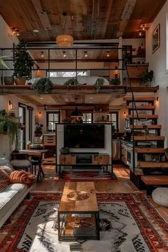 a living room filled with furniture and a flat screen tv on top of a wooden table