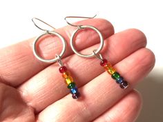 "Love these gorgeous colorful rainbow bead earrings! One of a kind earrings! They will go with so many outfits and make a beautiful statement! These earrings dangle about 2\" long and lightweight. I can make more of these earrings if you need more pairs. Just message me! A great gift for that special someone who has everything! Check out my other mixed metal earrings! https://www.etsy.com/shop/HeidiKindFinds?ref=hdr_shop_menu&search_query=mixed+metal+earrings" Rainbow Nickel-free Dangle Hoop Earrings, Nickel-free Rainbow Dangle Hoop Earrings, Rainbow Dangle Earrings For Everyday, Nickel-free Rainbow Round Beaded Earrings, Nickel Free Rainbow Beaded Earrings For Gifts, Rainbow Dangle Hoop Earrings With Ear Wire, Mixed Metal Earrings, Android Wallpaper Flowers, Wallpaper Flowers