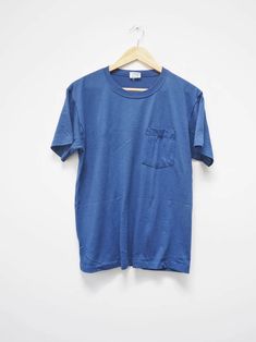 Plain Blue Watson's Tshirt Medium Blue Plain Chest - Etsy Affordable Blue Fan Apparel Shirt, Classic Blue T-shirt For Streetwear, Blue Crew Neck T-shirt With Pockets, Blue Vintage T-shirt With Relaxed Fit, Blue Pre-shrunk T-shirt For Everyday, Vintage Washed Blue Crew Neck Top, Blue T-shirt With Pockets And Short Sleeves, Blue Short Sleeve Tops Made In Usa, Blue Vintage Tops With Relaxed Fit