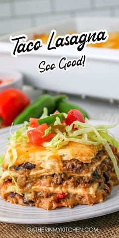 taco lasagna on a plate with lettuce and tomatoes