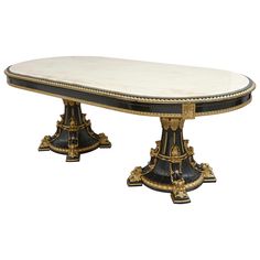 an ornately decorated table with black and gold trimmings on the top, against a white background