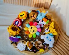 there are many crocheted keychains in the shape of animals on a wooden tray